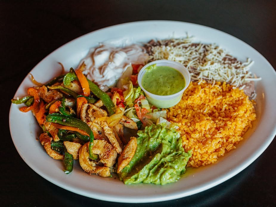 Fajitas plate with peppers and tortillas